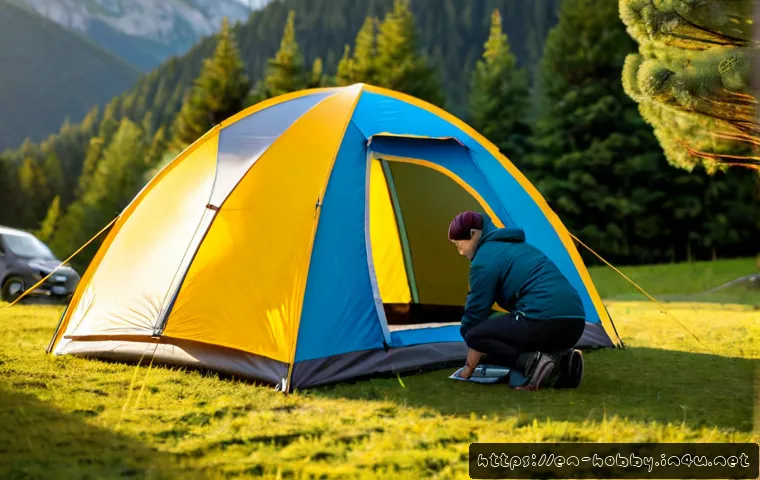 Home 15 텐트 설치 팁 - Photorealistic wide-angle campsite scene at sunrise, an adult camper in practical outdoor clothing a...